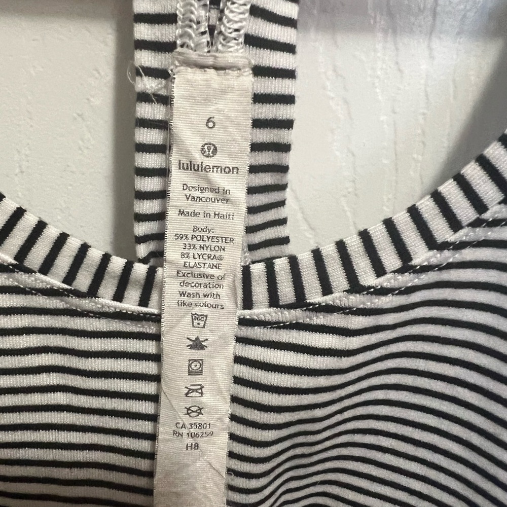 Tank top, worn a few times, no holes. Non smoke home